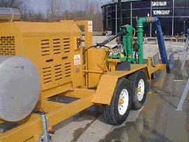Industrial trailer-mounted pump on a construction site.