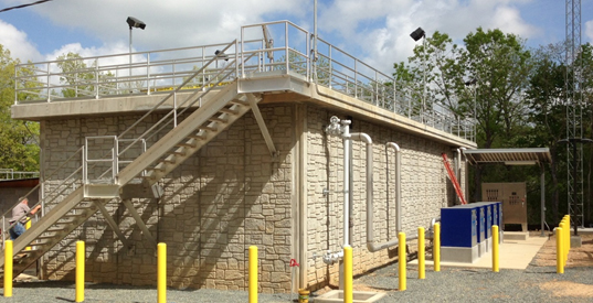 Industrial building with stairs and safety railings.